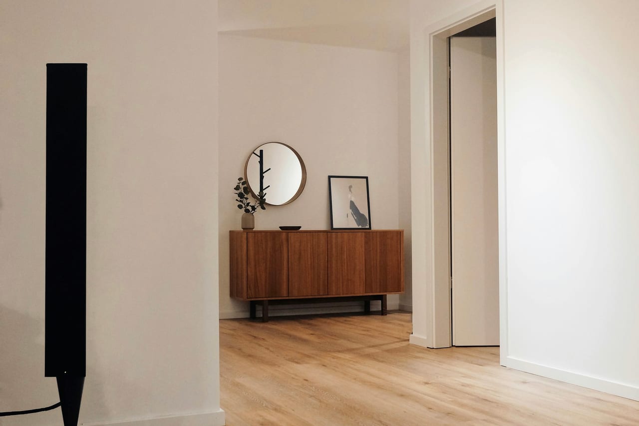 Reference interior with warm timber, pale surfaces and natural light; not Morrow Span work